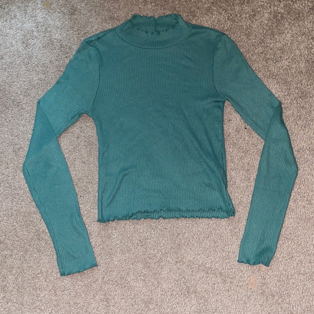 American Eagle cap neck long sleeve sweater with ruffle edges.
